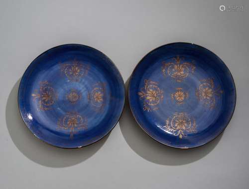 A PAIR OF BLUE GLAZED PLATES WITH GOLD PAINTING OF LOTUS FLO...