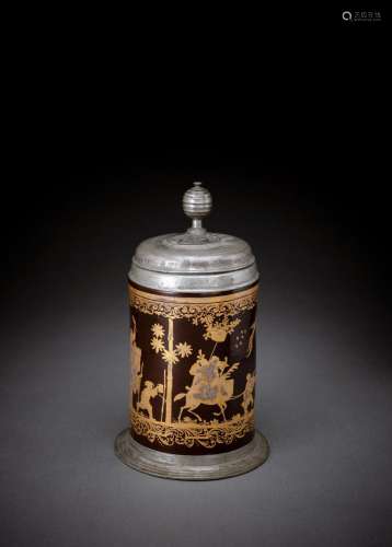 A PEWTER-MOUNTED GERMAN FAYENCE BROWN LACQUER-GROUND TANKARD...