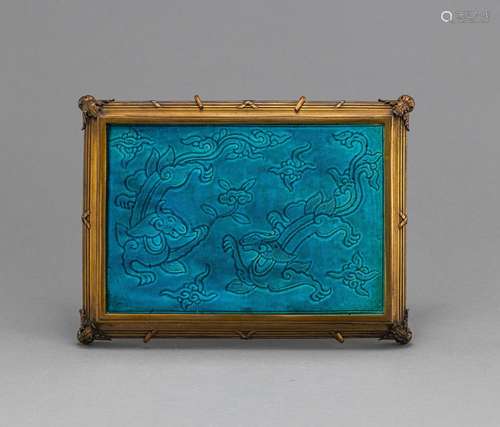 A TURQUOISE-GLAZED POTTERY PANEL WITH CHILONG MOUNTED IN A G...