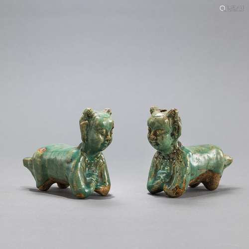 TWO GREEN-GLAZED BOY-SHAPED BRUSH RESTS