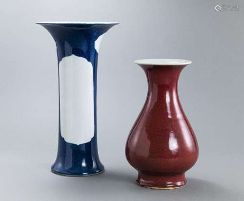 A POWDER-BLUE-GROUND SLEEVE VASE AND A COPPER-RED VASE