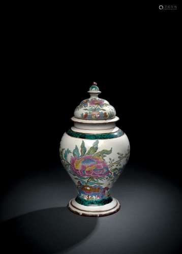 A GERMAN FAYENCE BALUSTER VASE AND COVER