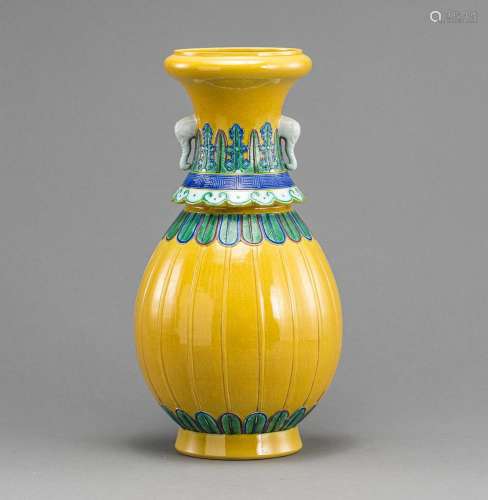 A YELLOW-GLAZED PORCELAIN VASE WITH BLUE AND GREEN DETAILS A...