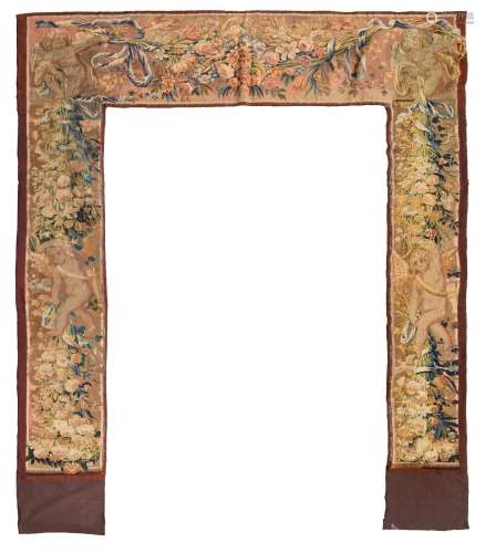 A TAPESTRY BORDER FRAGMENT USED AS A DOOR FRAME DECORATION