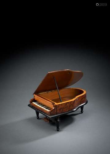 A MINIATURE MODEL OF A PIANO WITH MUSIC BOX