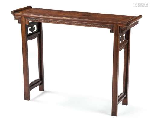 A RECESSED-LEG TABLE WITH BRAID-CARVED APRON
