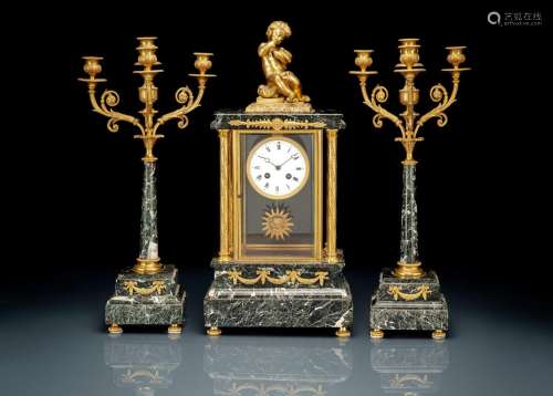 A FRENCH GREEN MARBLE AND BRONZE THREE-PIECE CLOCK GARNITURE