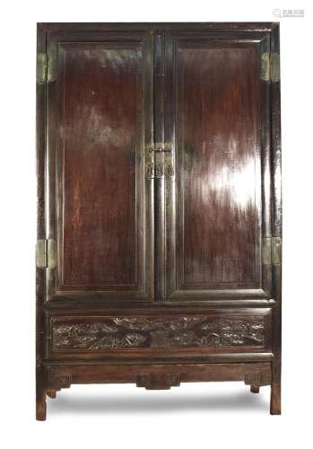A TWO-DOOR HARDWOOD CABINET WITH BAT-DECORATED DRAWER