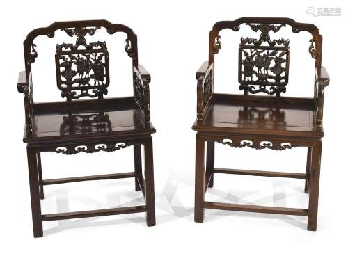 A PAIR OF HARDWOOD CHAIRS WITH ANTIQUITIES DECOR CARVED INTO...