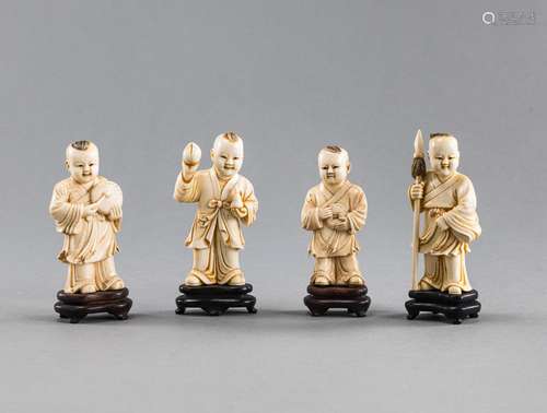 A GROUP OF FOUR CARVED IVORY BOYS MAKING MUSIC