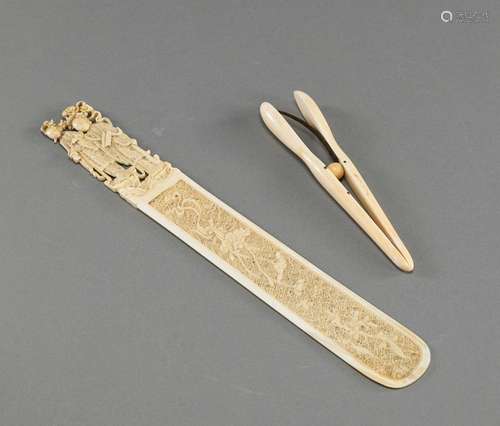 A FINE CARVED IVORY LETTER OPENER AND A GLOVE STRETCHER