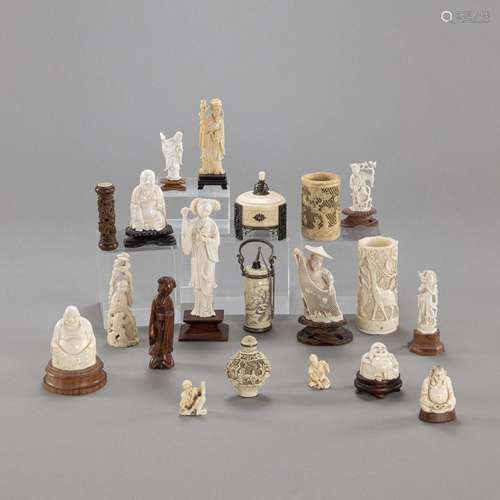 A GROUP OF 21 IVORY AND WOOD CARVINGS