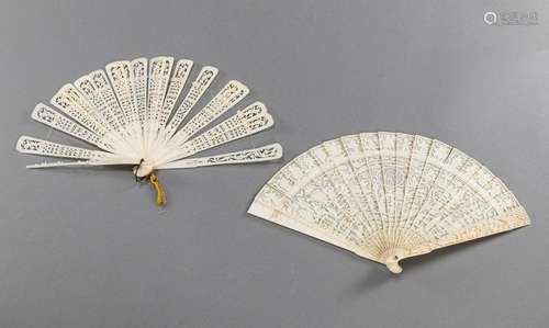 A FINE OPENWORK IVORY FAN WITH AMORIAL DECORATION