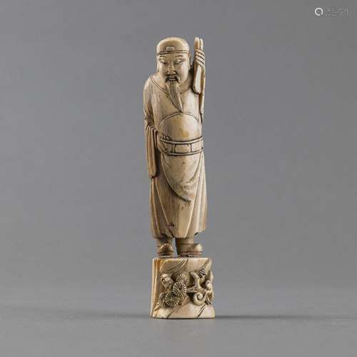 A SMALL IVORY FIGURE OF THE DAOIST IMMORTAL CAO GUOJU