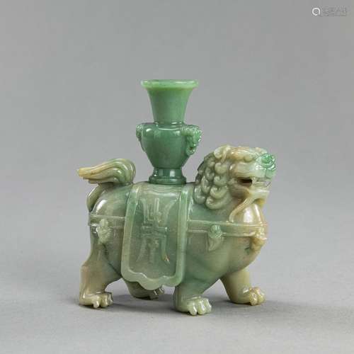 A JADEITE CARVING OF A LION CARRYING A VASE