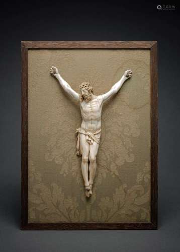 A CARVED IVORY BODY OF CHRIST