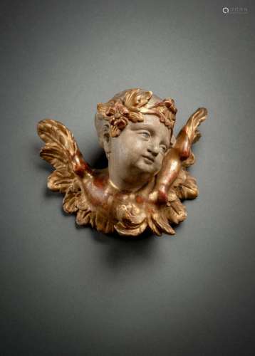A SOUTH GERMAN WINGED PUTTO HEAD