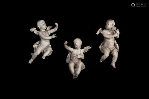 A GROUP OF THREE BAROQUE WINGED PUTTI