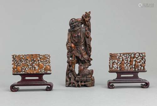 TWO SMALL CARVED OPENWORK WOOD PANELS AND A WOOD FIGURE