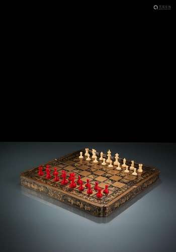 A CHESS BOARD WITH GOLD PAINTING AND IVORY FIGURES