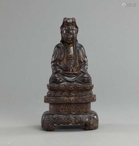 A CARVED WOOD FIGURE OF GUANYIN WITH LACQUERED AND GILT-DECO...