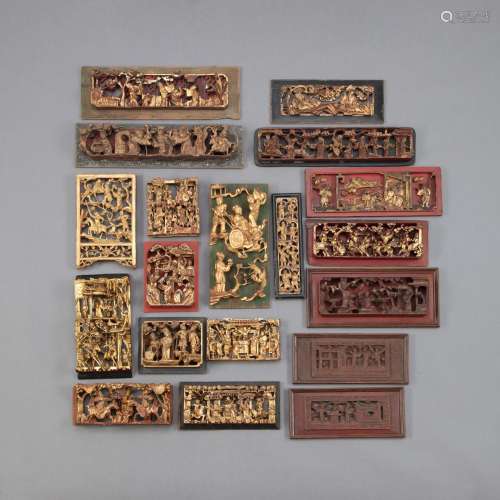 A GROUP OF 19 PART-GILT WOOD RELIEF CARVINGS