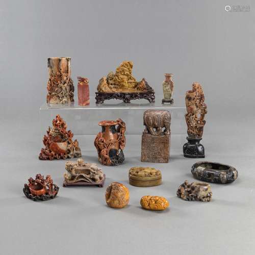 A GROUP OF 15 SOAPSTONE CARVINGS, E.G. VASES, BOXES, A SCHOL...