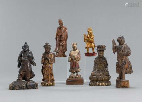 SEVEN CARVED PART-LACQUERED WOOD FIGURES