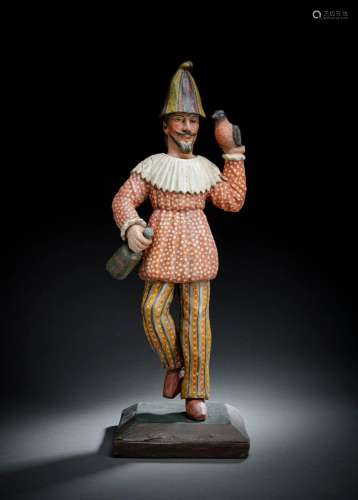 A RARE WOOD FIGURE OF HARLEQUIN WITH A PARROT AND A BOTTLE