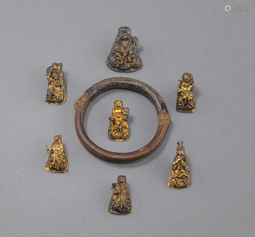 A GROUP OF SEVEN METAL APPLIQUÉS IN THE SHAPE OF THE GODS OF...