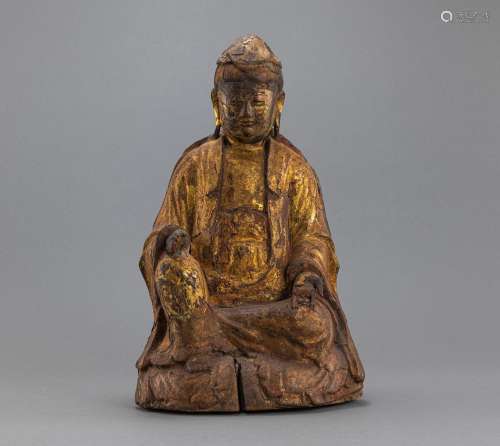 A GILT-LACQUERED WOOD CARVING OF GUANYIN