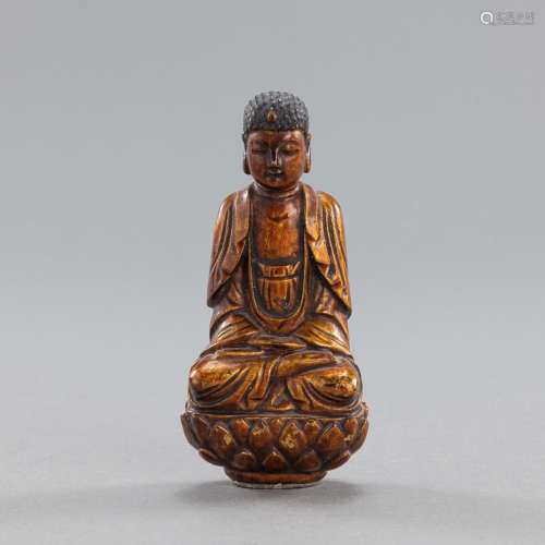 A CARVED GILT-LACQUERED WOOD FIGURE OF BUDDHA