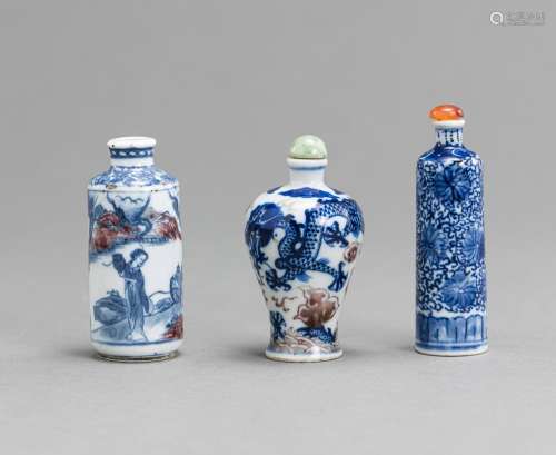 THREE BLUE AND WHITE PORCELAIN SNUFFBOTTLES, TWO WITH ADDITO...