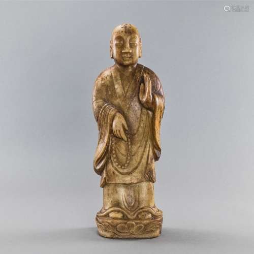 SOAPSTONE FIGURE OF A MONK WITH A PRAYER BEADS