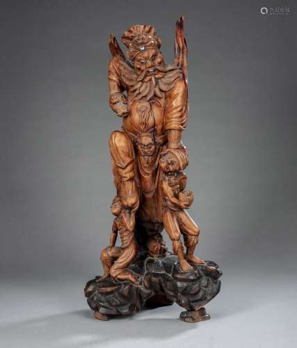 A LARGE BOXWOOD CARVING OF THE DEMON SLAYER ZHONG KUI WITH T...