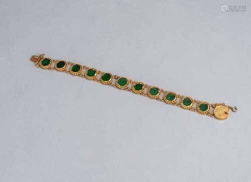 AN INLAID GOLDEN BRACELET WITH COIN-END
