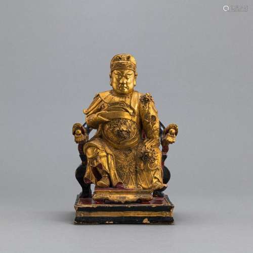 A GILT-LACQUERED WOOD CARVING OF A SEATED DIGNITARY