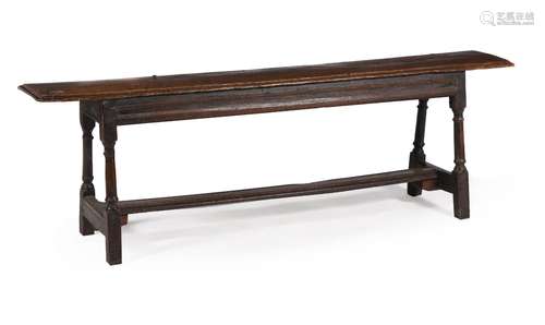 AN OAK BENCH OR LONG STOOL, FIRST HALF 17TH CENTURY