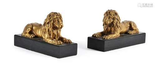 A PAIR OF GILT BRONZE LIONS, 20TH CENTURY