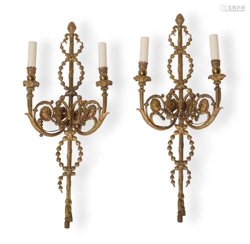 A PAIR OF GILT BRONZE TWO LIGHT WALL APPLIQUÉS, IN THE NEO-C...