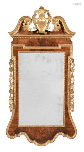 A GEORGE II WALNUT AND GILTWOOD WALL MIRROR, CIRCA 1740