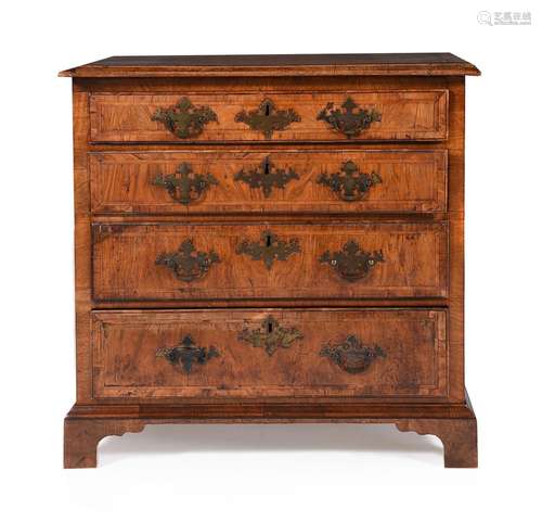 A GEORGE II WALNUT AND FEATHER BANDED CHEST OF DRAWERS, CIRC...