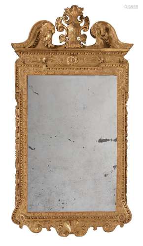 A GEORGE II GILTWOOD WALL MIRROR, IN THE MANNER OF WILLIAM K...