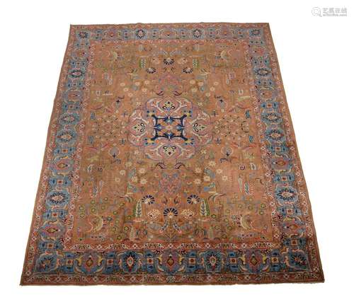 A TABRIZ CARPET, SIGNED BY THE MASTER WEAVER JAVAN AMIR KHIZ...