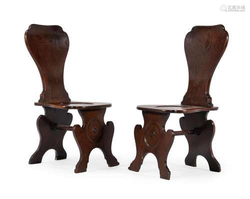 A PAIR OF GEORGE II MAHOGANY HALL CHAIRS, CIRCA 1740