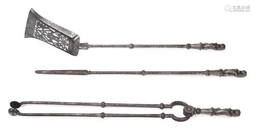 A SET OF THREE LION HANDLED POLISHED STEEL FIRE TOOLS, EARLY...