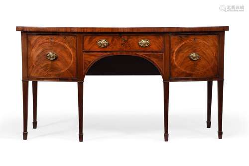 A GEORGE III MAHOGANY AND CROSSBANDED BOWFRONT SIDEBOARD, IN...