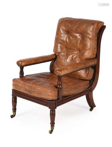 A REGENCY MAHOGANY AND LEATHER UPHOLSTERED LIBRARY ARMCHAIR,...