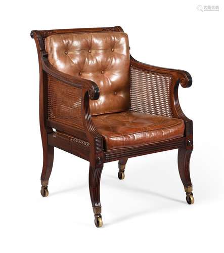 A REGENCY MAHOGANY BERGERE LIBRARY ARMCHAIR, ATTRIBUTED TO G...