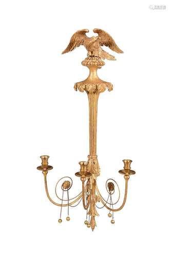 A SET OF FOUR REGENCY CARVED GILTWOOD WALL LIGHTS, IN THE MA...